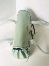 Load image into Gallery viewer, Light green travel bag with a brand logo on a white background