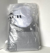 Load image into Gallery viewer, Coach New York hat wrapped in clear plastic packaging on a white background