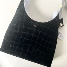 Load image into Gallery viewer, Black textured handbag with Coach logo on a white background