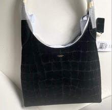 Load image into Gallery viewer, Black textured bag with a visible brand logo on a white surface