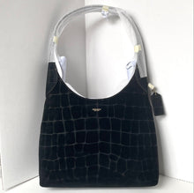 Load image into Gallery viewer, Black textured handbag with Coach logo on a white background