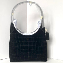 Load image into Gallery viewer, Black textured handbag with a clear plastic cover on a white background