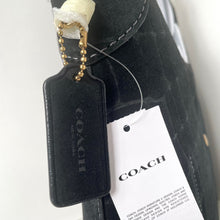Load image into Gallery viewer, Black Coach handbag with a tag on a white background