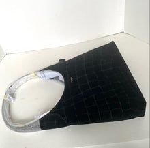 Load image into Gallery viewer, Black textured bag with a white strap on a white background