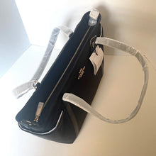 Load image into Gallery viewer, Black handbag with a gray strap on a light background