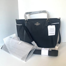 Load image into Gallery viewer, Black Coach bag with gray accents on a white background