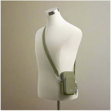 Load image into Gallery viewer, Green crossbody bag on a mannequin against a plain background