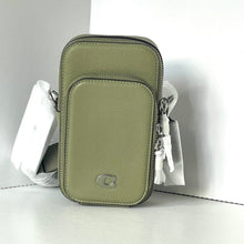 Load image into Gallery viewer, Green crossbody bag with a visible brand logo on a white background