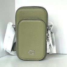 Load image into Gallery viewer, Green leather crossbody bag with a visible brand logo on a white background