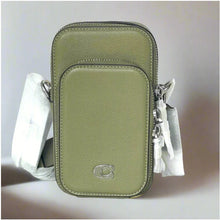 Load image into Gallery viewer, Green leather crossbody bag with white tassels on a light gray background