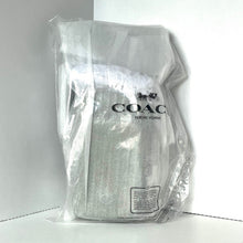 Load image into Gallery viewer, Coach backpack in clear plastic packaging on a white background