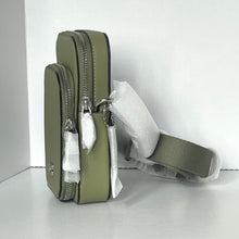 Load image into Gallery viewer, Green leather bag with a strap on a white background