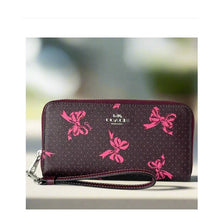 Load image into Gallery viewer, Coach CZ327 Pink Bow Zip Around Wallet Merlot Canvas Phone Wristlet