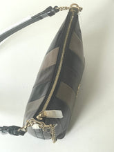 Load image into Gallery viewer, A black leather shoulder bag with diagonal stitched paneling and gold-tone hardware, including a zipper, chain strap, and decorative tag, shown on a plain white background.