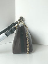 Load image into Gallery viewer, A dark brown leather handbag with a gold chain strap, shown from a side profile against a white background.