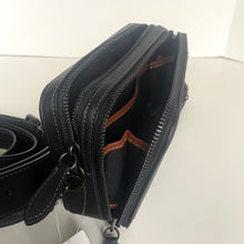 Load image into Gallery viewer, Black leather bag with a strap on a white background