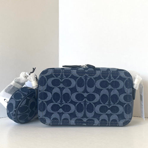 Navy blue cosmetic bag with brand logo on a white background