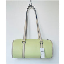 Load image into Gallery viewer, Light green handbag with beige strap on a white background