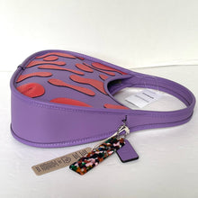 Load image into Gallery viewer, Purple handbag with red abstract design on a white background