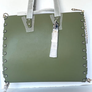 Green tote bag with decorative studs on a white background