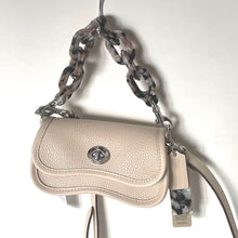 Load image into Gallery viewer, Beige handbag with a chain strap on a white background