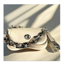 Load image into Gallery viewer, Beige handbag with a leopard print strap on a light background