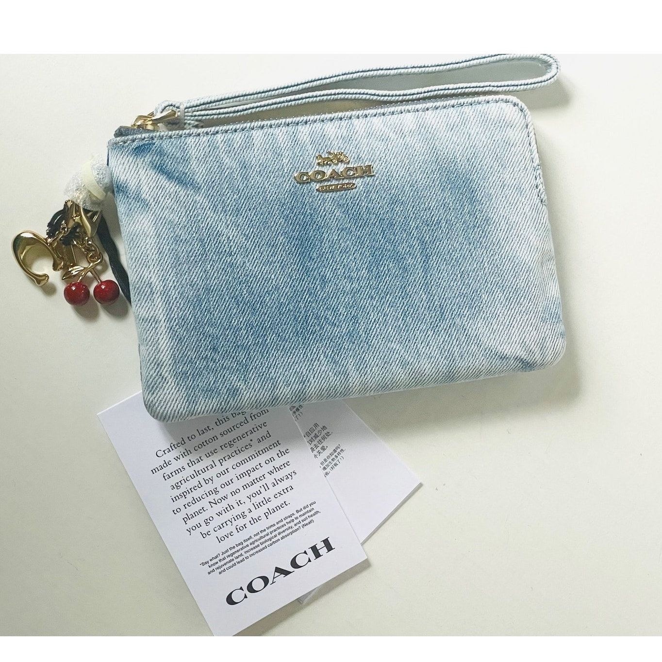 Coach Corner Zip Wristlet Blue Loved Denim Cherry Charms  Coach Wristlet In Denim With Charm main image 0