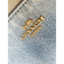 Load image into Gallery viewer, Gold jewelry pieces on a denim background