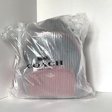 Load image into Gallery viewer, Coach bag wrapped in clear plastic on a white background