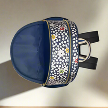 Load image into Gallery viewer, Navy blue backpack with floral pattern on a white background