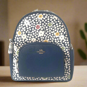 Blue backpack with floral pattern on a white background