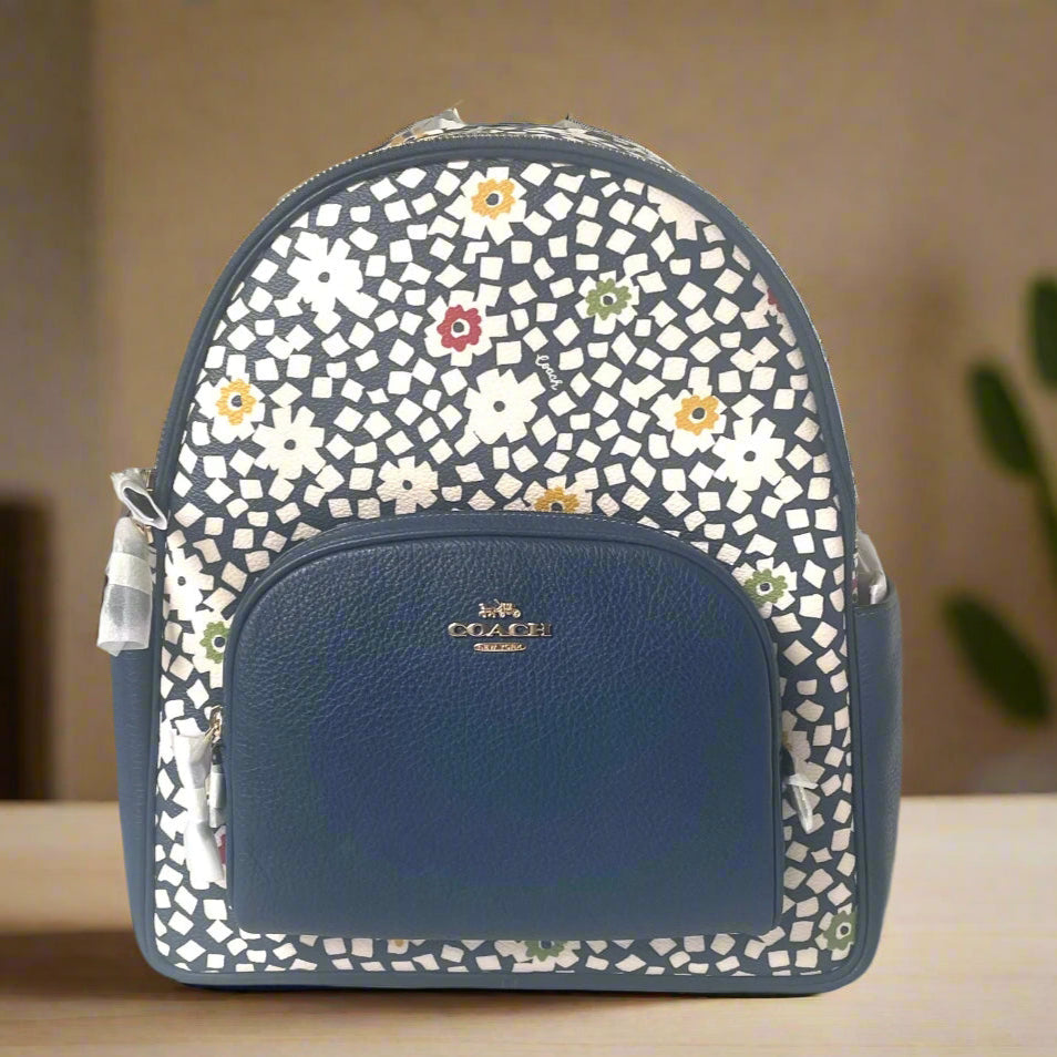 Blue backpack with floral pattern on a white background