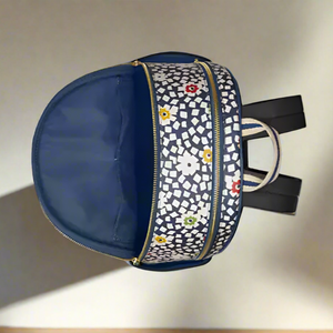 Navy blue backpack with floral pattern on a white background