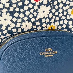 Blue Coach bag with floral patterned flap