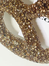 Load image into Gallery viewer, Close-up of a gold glittery ring on a white background
