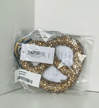 Load image into Gallery viewer, Gold circular objects in clear packaging with labels on a white background