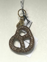Load image into Gallery viewer, Keychain with decorative design on a light gray background