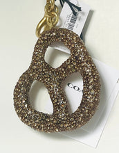 Load image into Gallery viewer, Gold sequin number 8 keychain with a tag on a white background