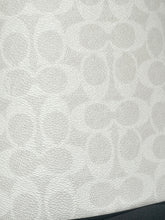 Load image into Gallery viewer, Close-up of a light gray and white textured material with a repeating monogram-style pattern.