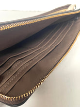 Load image into Gallery viewer, Close-up of a brown leather wallet with gold zipper on a light gray background