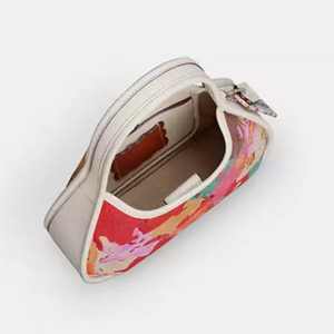 coach ergo bag with Floral patterned pouch on a white background