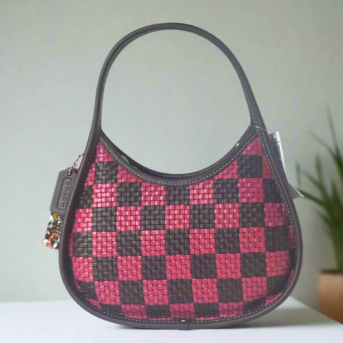 Coach Ergo leather Handbag with red and black checkered pattern on a white background