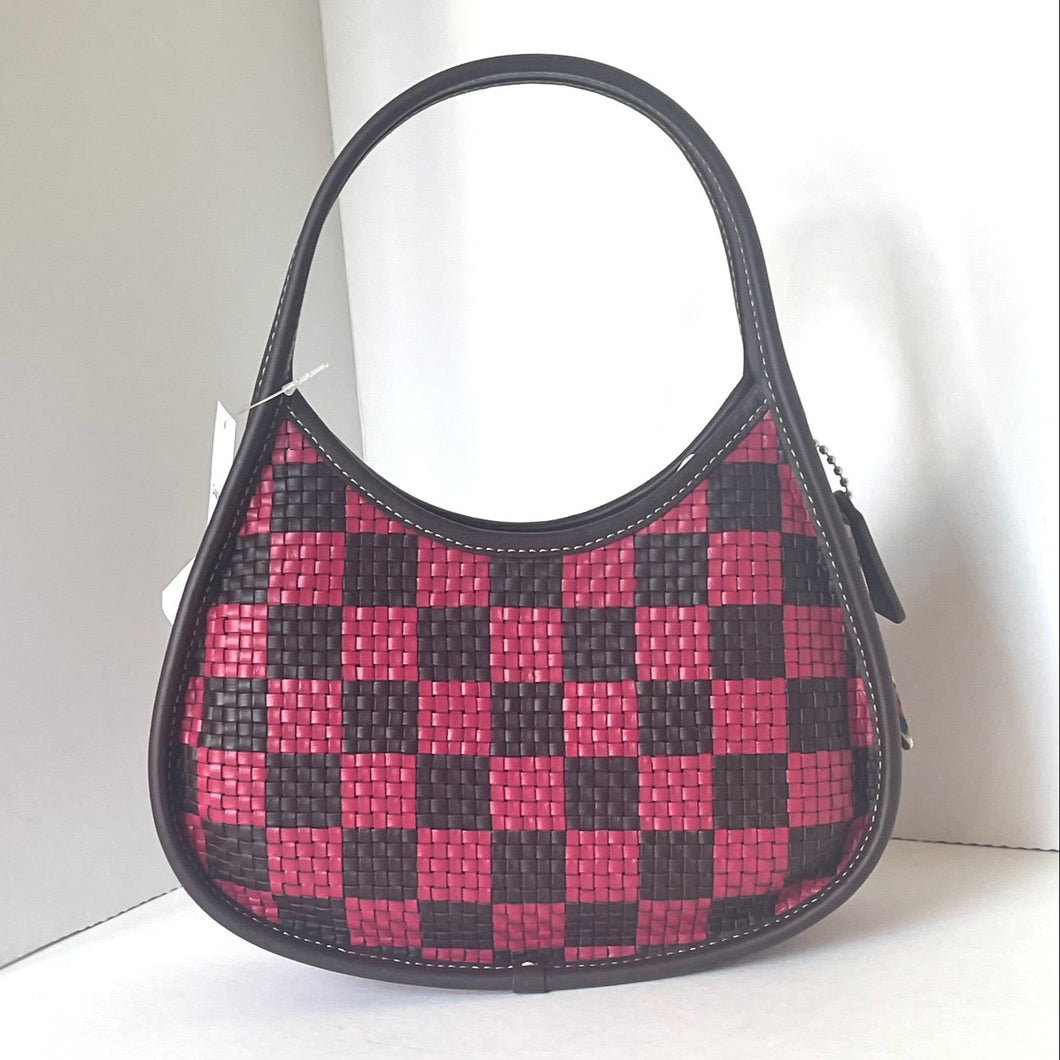 coach ergo Checkered handbag with red and black pattern on a white background