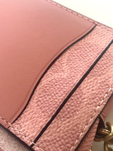 Load image into Gallery viewer, Close-up of a pink leather accessory showing two different textures: a smooth matte panel and a textured pebbled panel with contrast stitching.