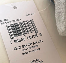 Load image into Gallery viewer, A close-up of a white garment price tag with a barcode and printed text, including 'B4YMW' and 'MADE IN VIETNAM', attached to a light-colored fabric item.