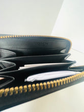 Load image into Gallery viewer, Black Coach wallet with gold zipper on a white background