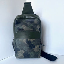 Load image into Gallery viewer, Camouflage-patterned sling bag with visible brand logo on a white background