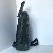 Load image into Gallery viewer, Green camouflage backpack with a zipper on a white background