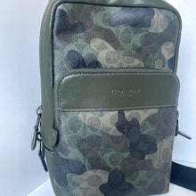 Load image into Gallery viewer, Green camouflage patterned bag with visible brand logo on a white background