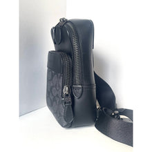 Load image into Gallery viewer, Black leather crossbody bag with a visible brand logo on a white background